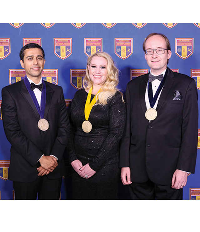 Three award winning scientists pose for the camera.