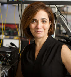 A woman smiles for the camera.