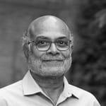 A black and white headshot of a man.